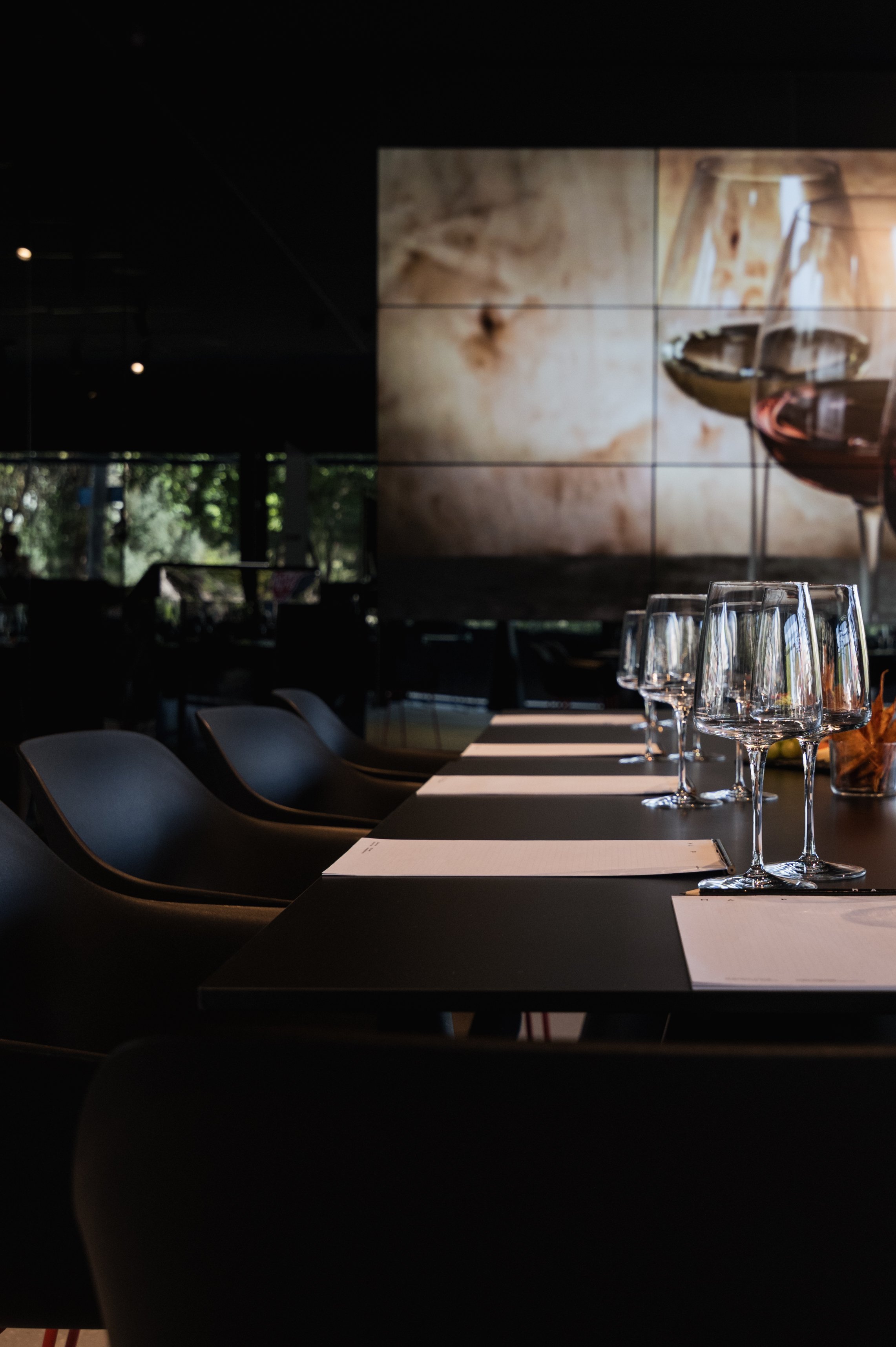 Restaurant table set with glassware and soft evening lighting.